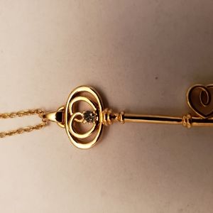 Necklace w key pendant with cz